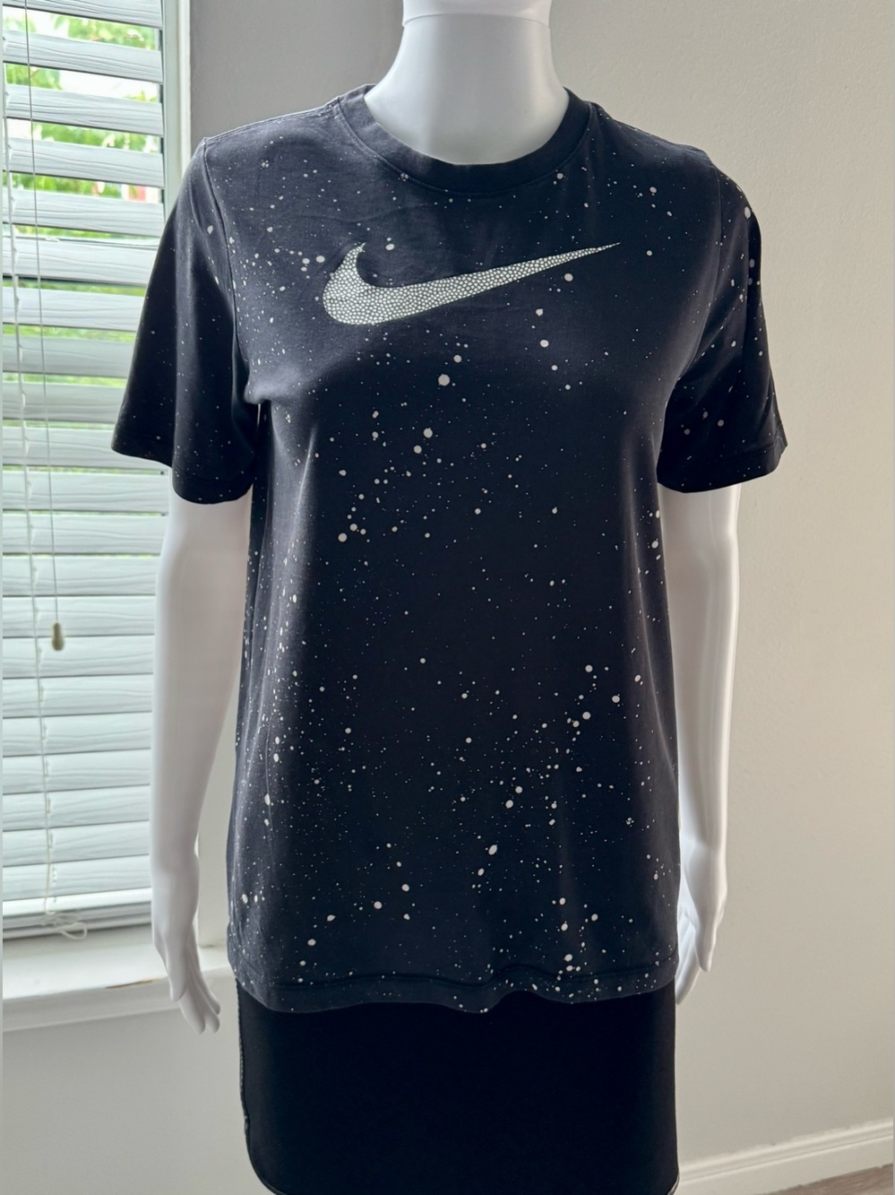 Nike Dri-FIT T-shirt featuring a Swoosh logo and an all-over "black paint splatt